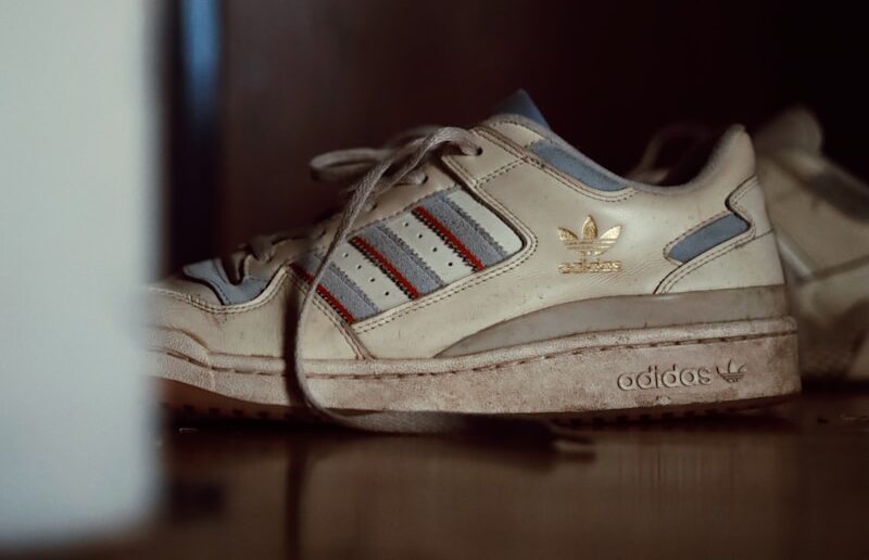 a pair of shoes sitting on top of a wooden floor